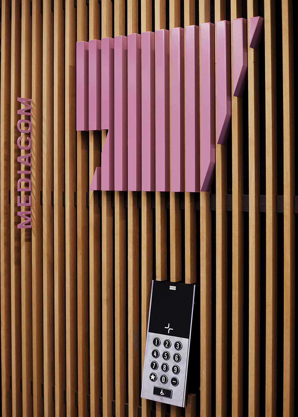 Pink Amsteldock lift floor level number signage