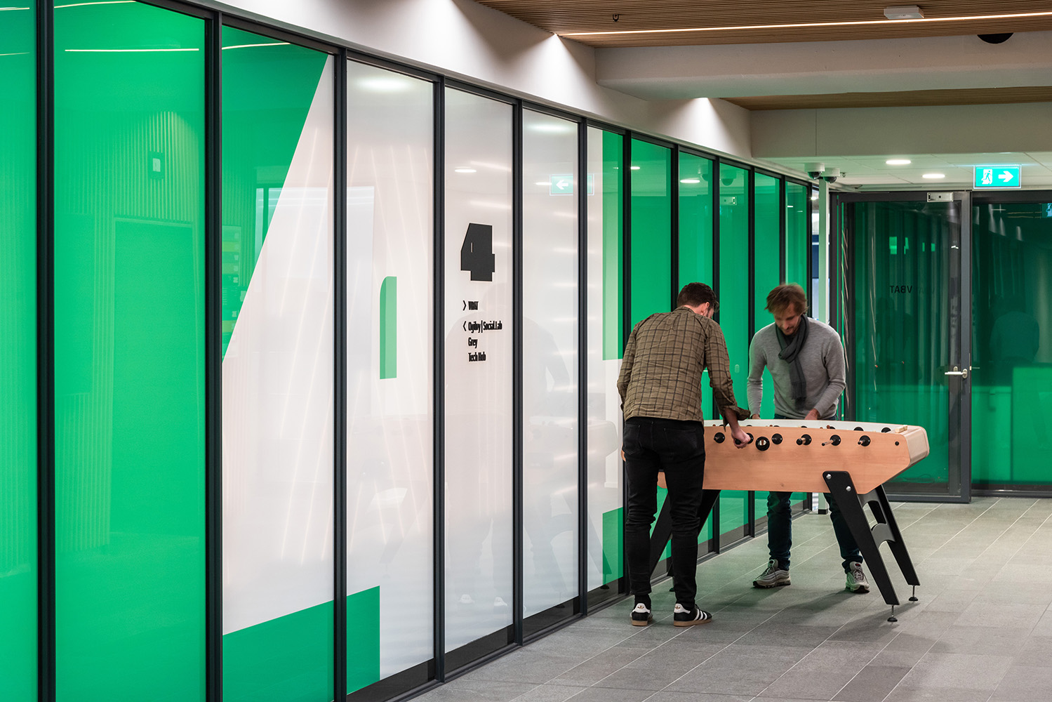 Floor level number and wayfinding at wall